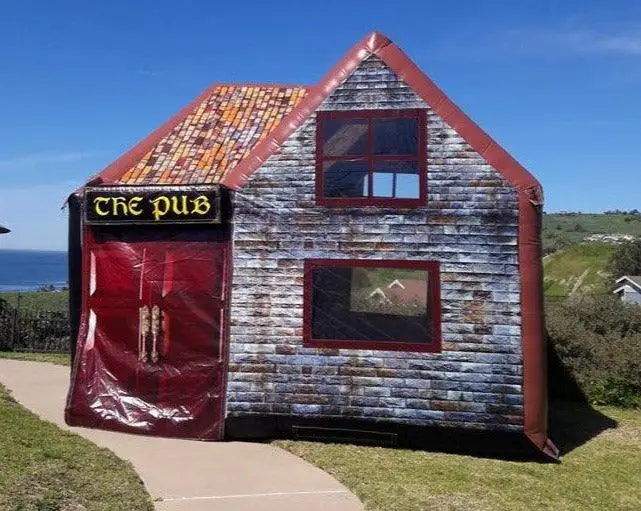 The Aer inflatable pub set up outdoors by the coast