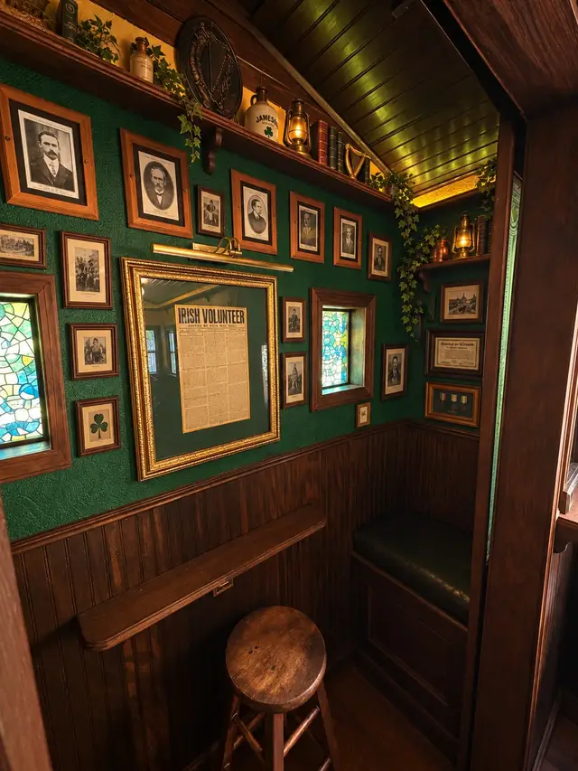 The wall of Irish portraits and memorabilia inside The Síbín’s snug